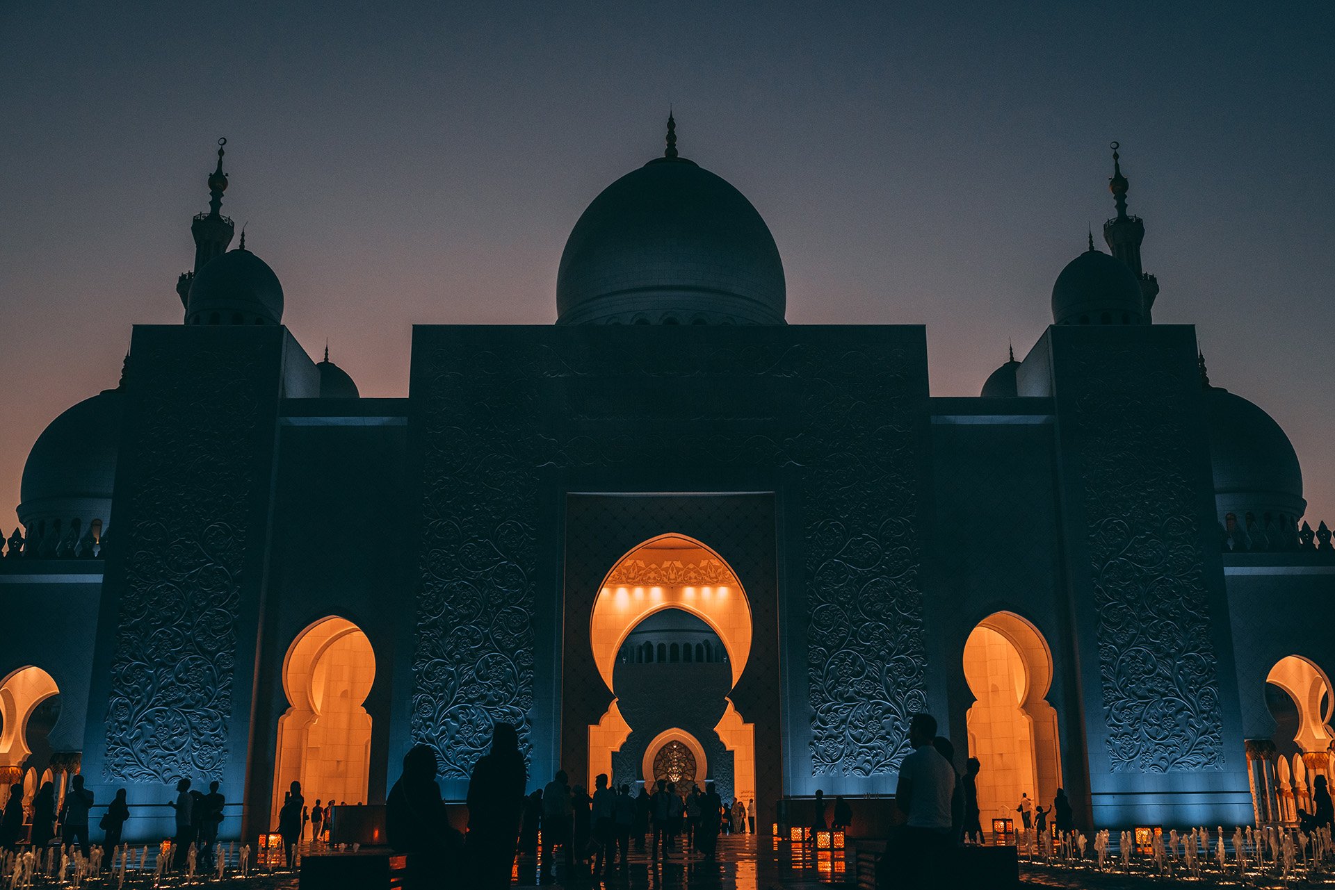 low-angle-shot-grand-mosque-abu-dhabi-with-glowing-lights-inside-building